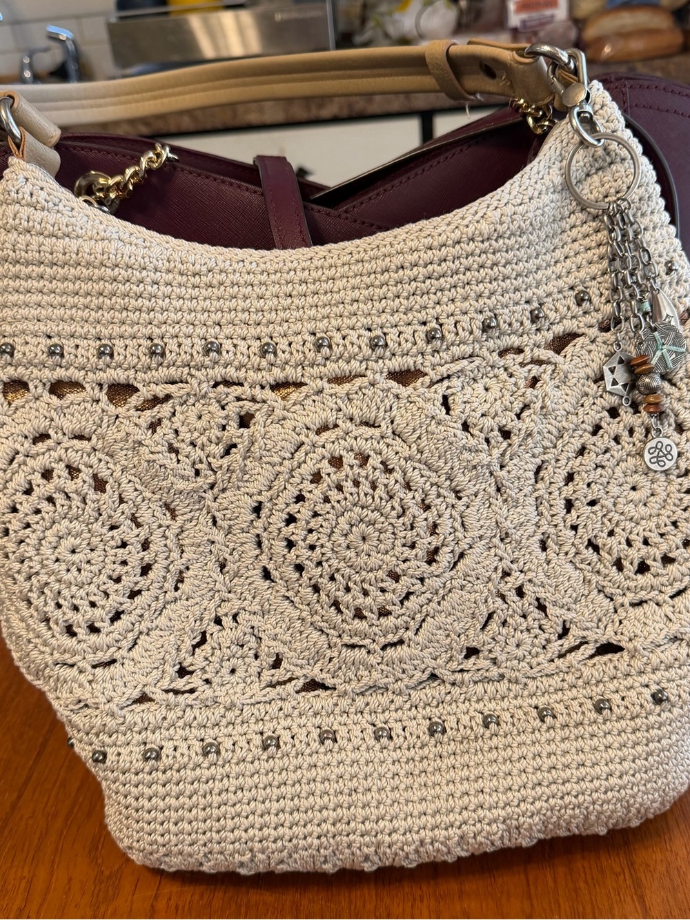 The Sak Cream Crochet Shoulder Bag with Charm Detail